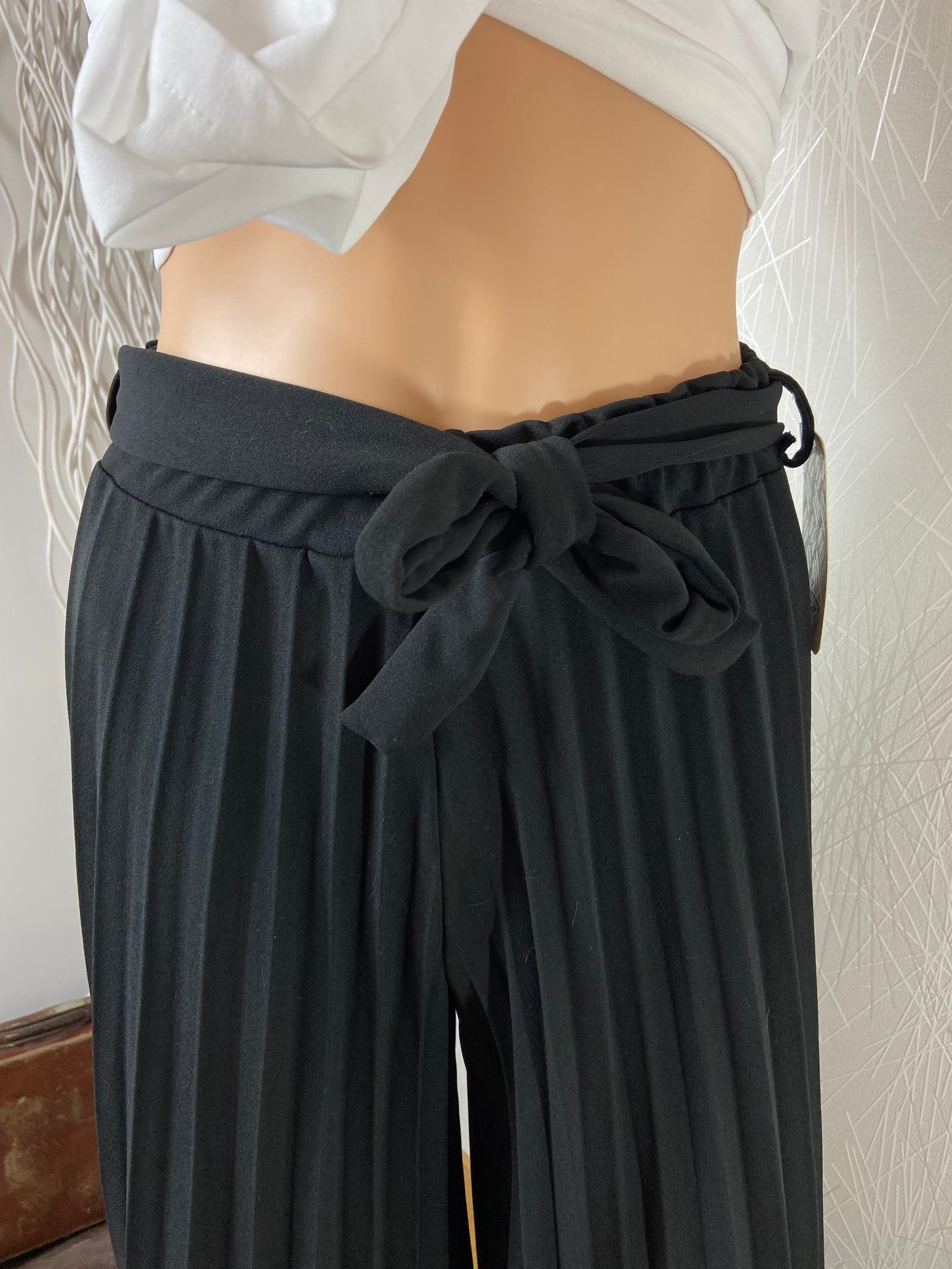 Pantalon noir plissé taille haute coupe ample